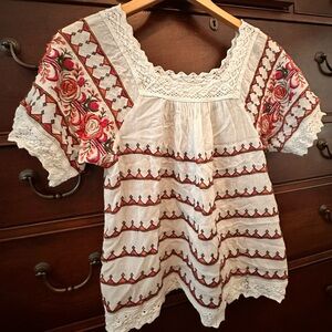 Anthropology multi colored embroidered crepe top.